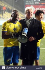 sint-truiden-belgium-november-25-yohan-boli-and-marc-brys-celebrate-after-winning-the-jupiler-pr.jpg