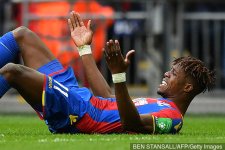 crystal_palaces_ivorian_striker_wilfried_zaha_reacts_after_being_599649.jpg